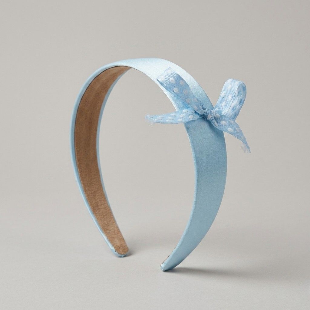baby-blue-satin-headband-histeria-concept-store.jpg Charming satin Baby Blue Hairband with a polka-dot bow by Histeria concept store.