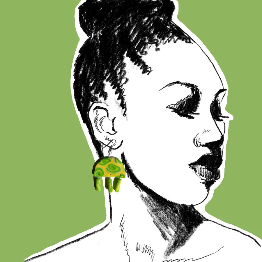 nausnice-africa-zeleno-zute-polimerna-glina.jpg Ručno rađene naušnice Africa od polimerne gline sa zelenim i žutim spiralnim motivima.